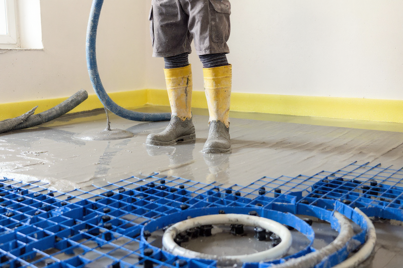 a man pouring concrete